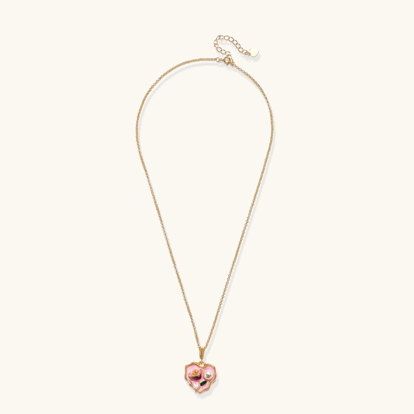 Gold-plated heart pendant necklace with pink enamel rose design and freshwater pearl on adjustable chain