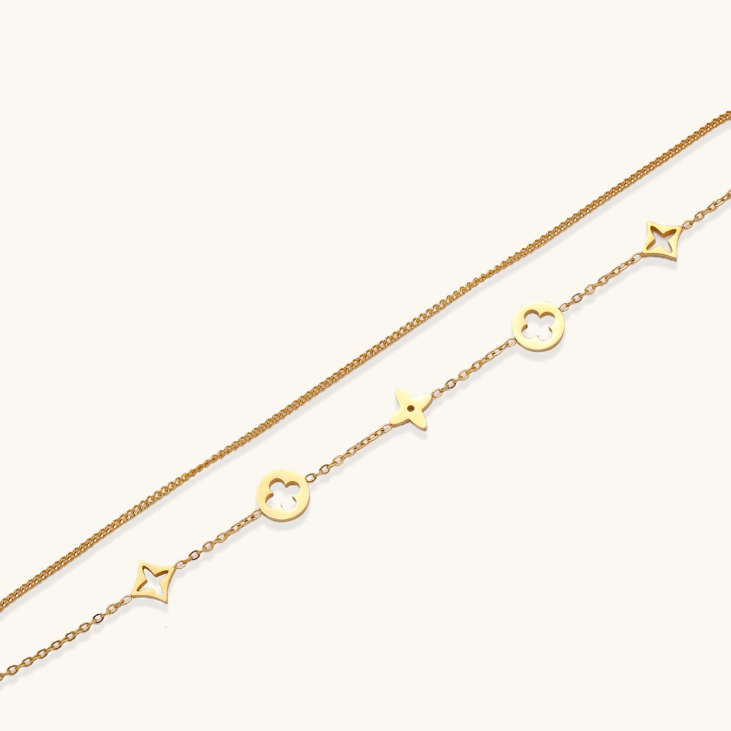 Dainty gold-plated bracelet with star and clover charms on double chain with adjustable extender