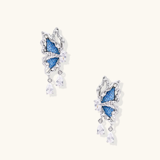 Gold-plated brass earrings featuring blue denim fabric insets and sparkling zirconia crystals with teardrop dangles