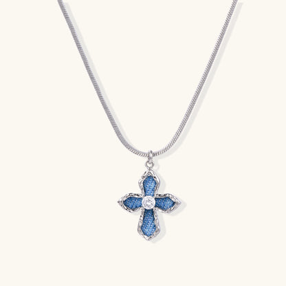 Gold-plated cross pendant with blue denim fabric insets and central zirconia stone on adjustable snake chain