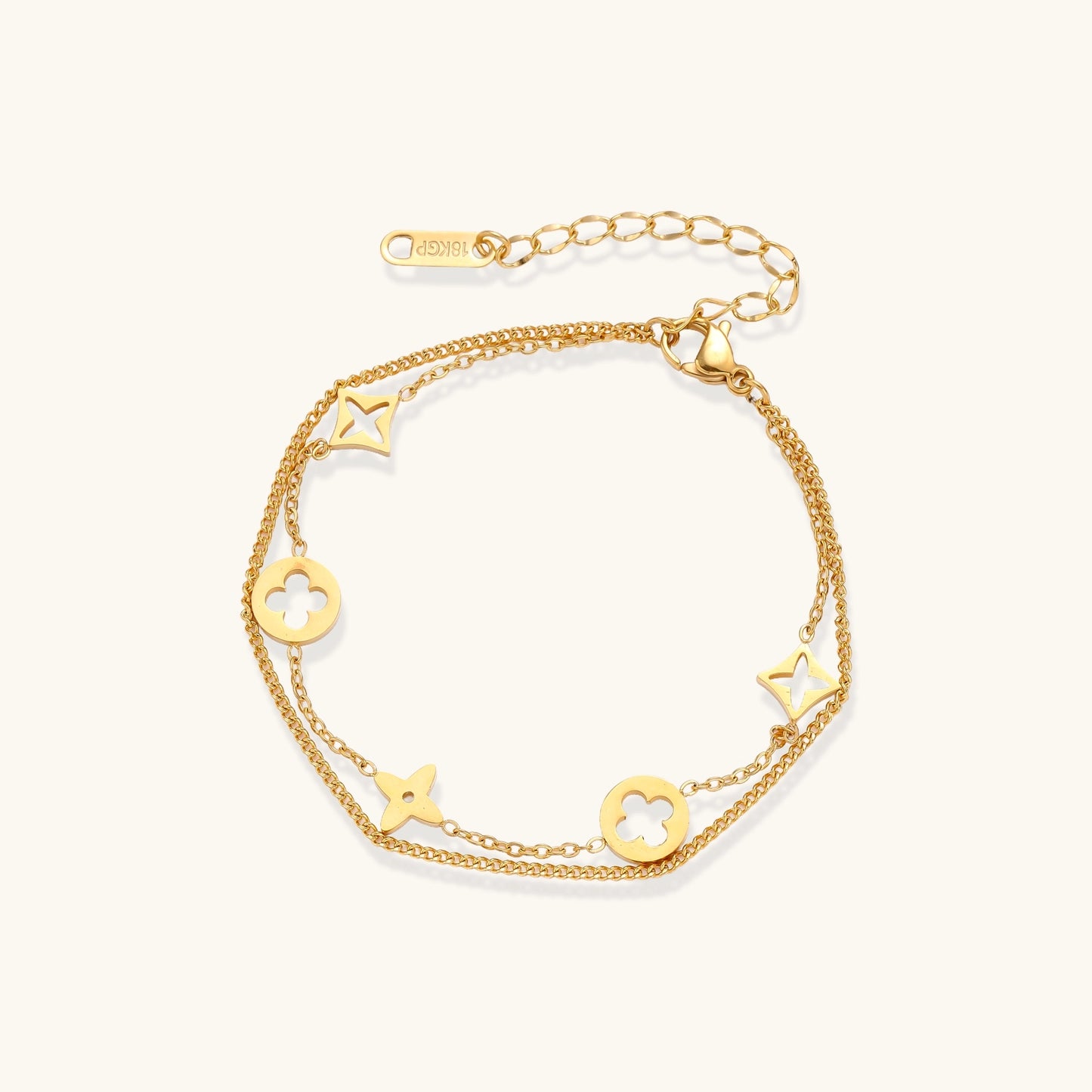 Dainty gold-plated bracelet with star and clover charms on double chain with adjustable extender
