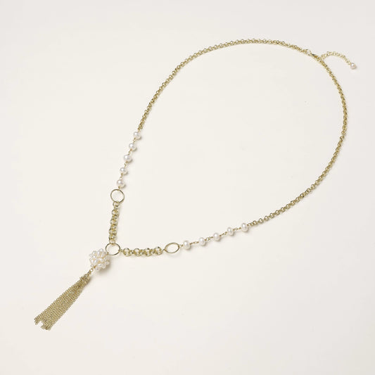 Long gold-plated necklace with freshwater pearls, chunky chain links, and flowing tassel pendant