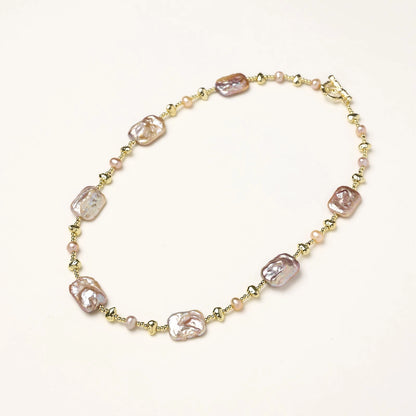 Iridescent baroque pearls alternating with small freshwater pearls on 14K gold-plated chain