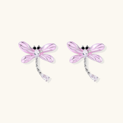 Long drop earrings with translucent lavender enamel dragonfly wings and white gold plated segmented bodies on white background