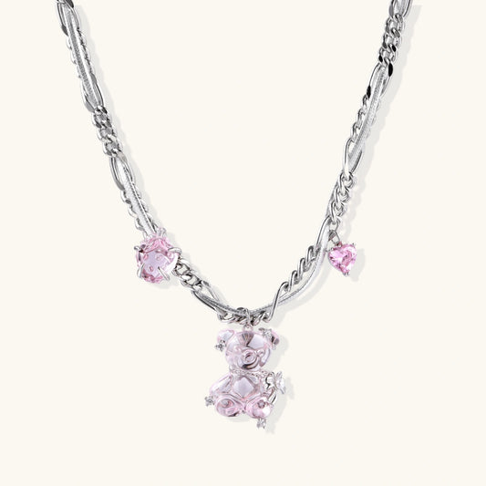 Silver twisted chain necklace with fairy tale carriage pendant adorned with pink cubic zirconia gemstones