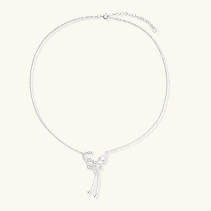 Sterling silver butterfly pendant with textured wing detail on adjustable Y-chain with ball drop ends