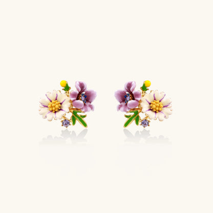 Cluster-style stud earrings with purple pansies, white daisies, yellow centers, and green leaves in glossy enamel finish