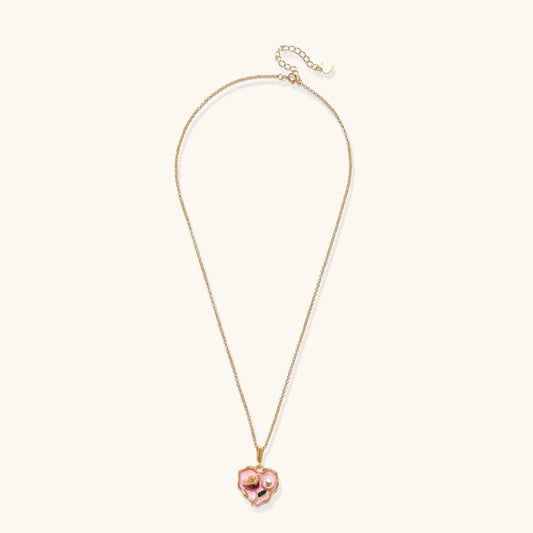 Heart-shaped pendant with pink enamel, rose design, freshwater pearl flower, and gold scalloped frame on delicate chain