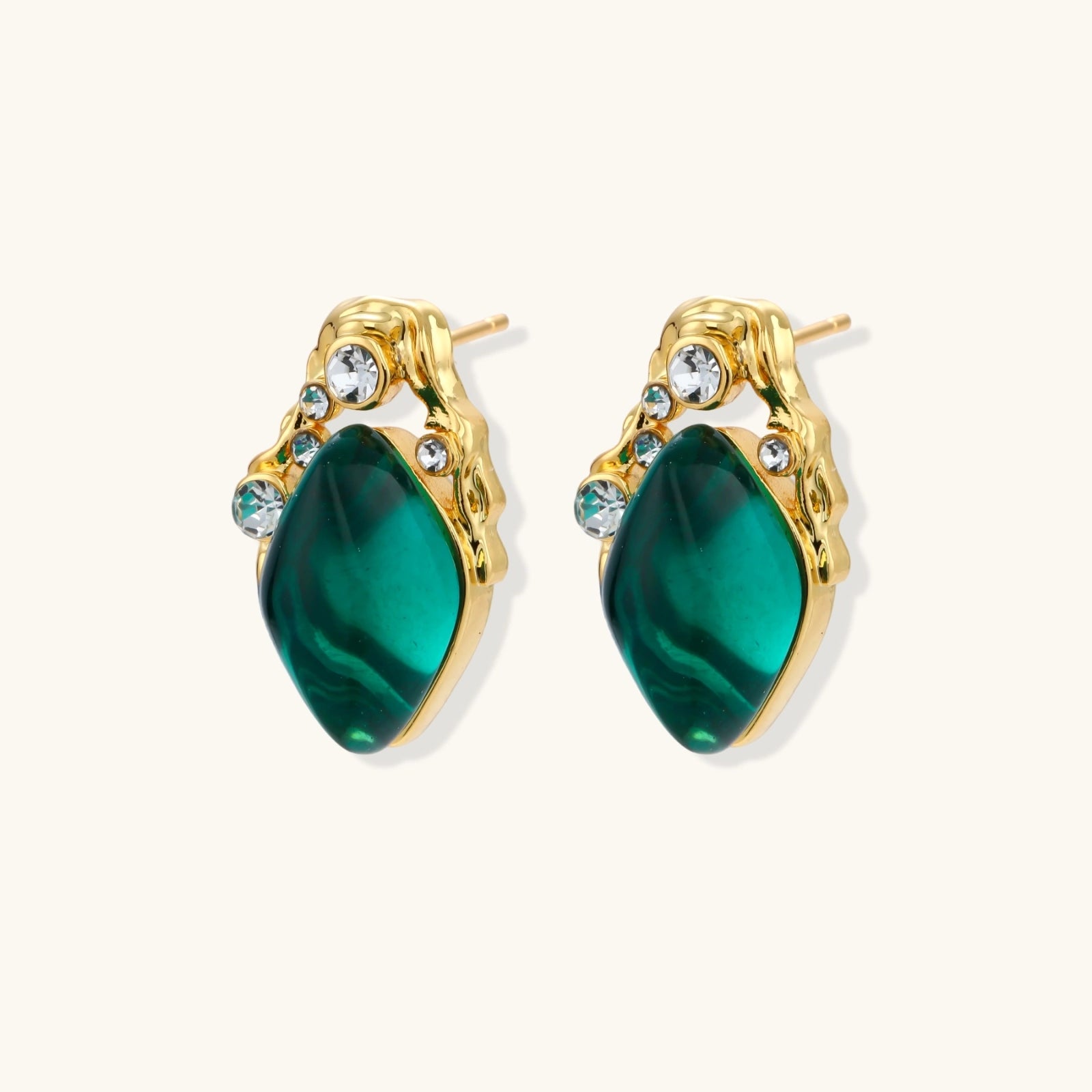 Gold-plated stud earrings featuring teardrop emerald green liuli stones with cubic zirconia crystal accents on white background.